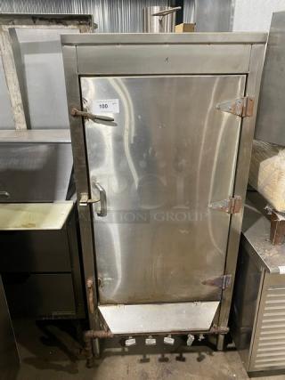 Commercial stainless steel natural gas smoker oven with right-side hinged door, on legs, used condition, item tag "100".