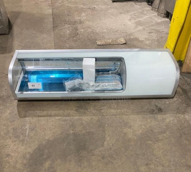 Marchia MSU150S 53" stainless steel curved glass refrigerated sushi display, new condition, with LED lights and rear sliding doors.