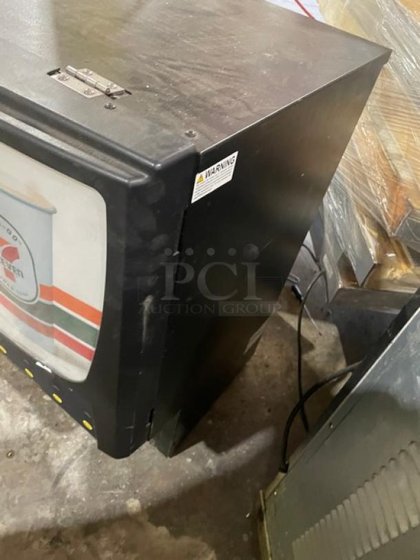 Curtis PCGT6300 black countertop cappuccino machine, 6-flavor, digital controls, electric powered, 120V 1 Phase, good condition.