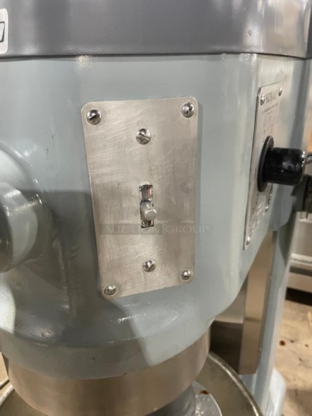 Hobart H600 commercial mixer with stainless steel bowl, spiral dough hook, 208V 3-phase; heavy-duty on legs, visible label.