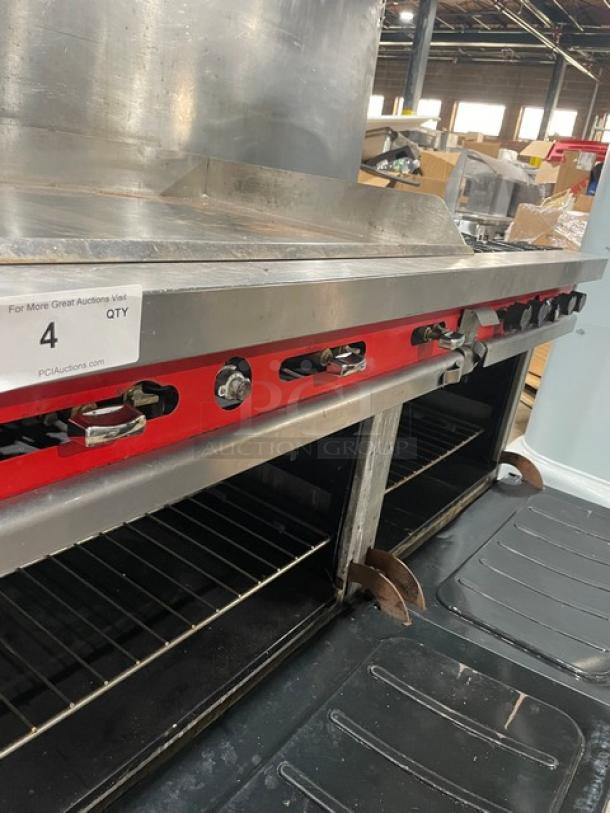 Vulcan commercial stainless steel gas griddle with split top, 4-burner range, double oven, backsplash, wired racks.