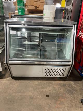Leader Commercial Stainless Steel Refrigerated Display; slanted glass, rear sliding doors, lower storage, excellent condition.
