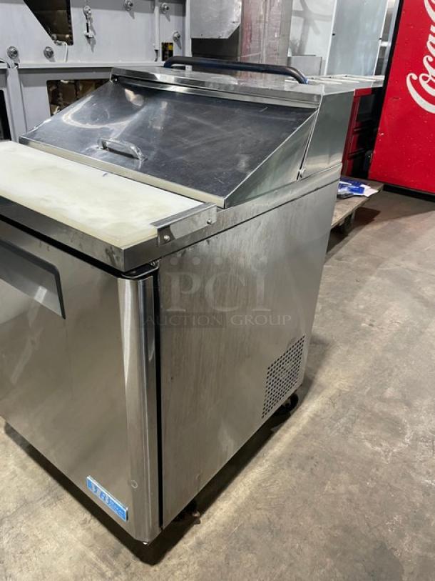 Turbo Air M3 Series single door refrigerated prep table, model MST-28, with cutting board and poly coated wire rack, on casters.