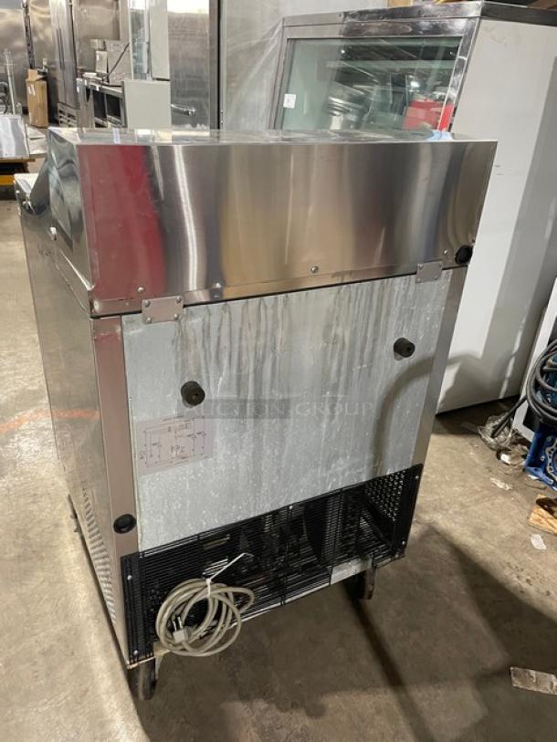 Turbo Air MST-28 refrigerated bain marie style prep table, stainless steel, single door, with cutting board, poly-coated wire rack, on casters.