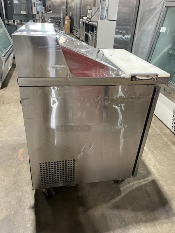Turbo Air M3 Series MST-28 single door refrigerated prep table. Stainless steel, cutting board, poly-coated wire rack, on casters.