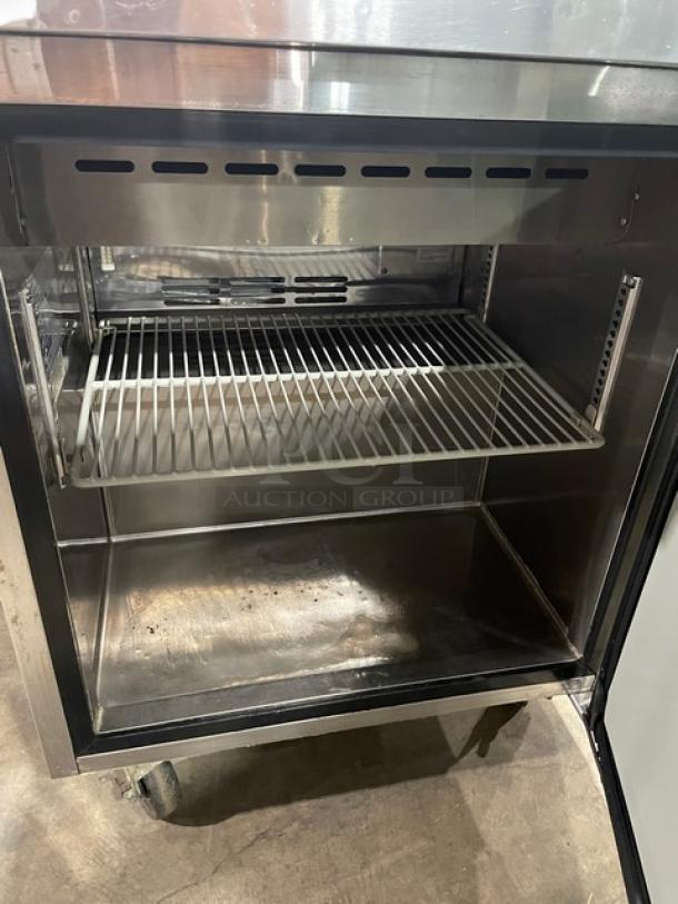 Turbo Air MST-28 commercial stainless steel single door refrigerated prep table with cutting board and poly-coated wire rack.