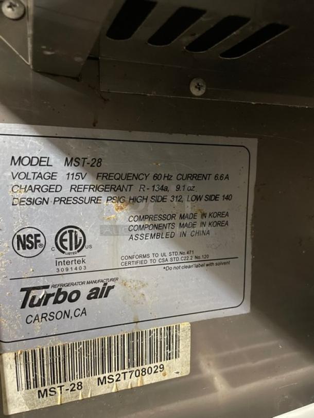 Turbo Air MST-28 label showing specifications: 115V, 60Hz, 6.6A, R-134a refrigerant, certified by NSF and Intertek.