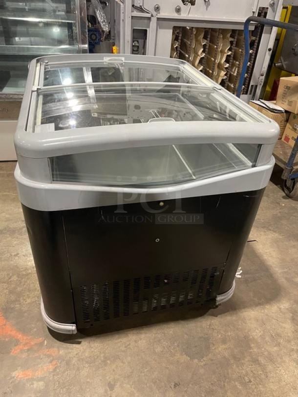 AHT Commercial Black Glass Top Ice Cream Merchandiser. Double sliding lid, on casters. Excellent condition.