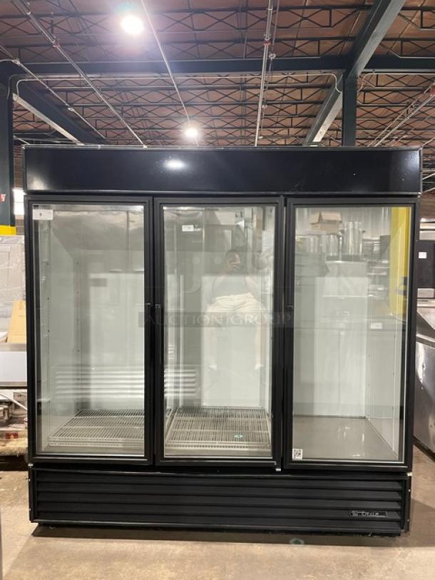 True Commercial GDM-72 Triple Glass Door Merchandiser Refrigerator; black, poly-coated wire racks, 115V, 1 Phase.