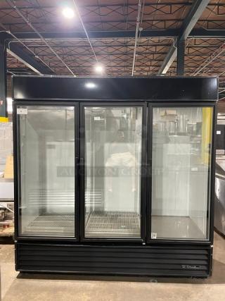 True Commercial GDM-72 Triple Glass Door Merchandiser Refrigerator; black, poly-coated wire racks, 115V, 1 Phase.