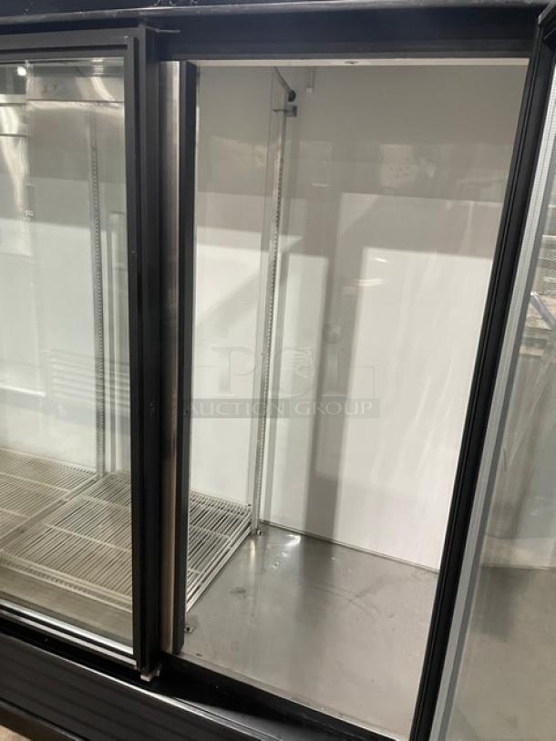 True GDM-72 commercial refrigerator, black triple glass swing doors, poly-coated wire racks, 115V 1 Phase.