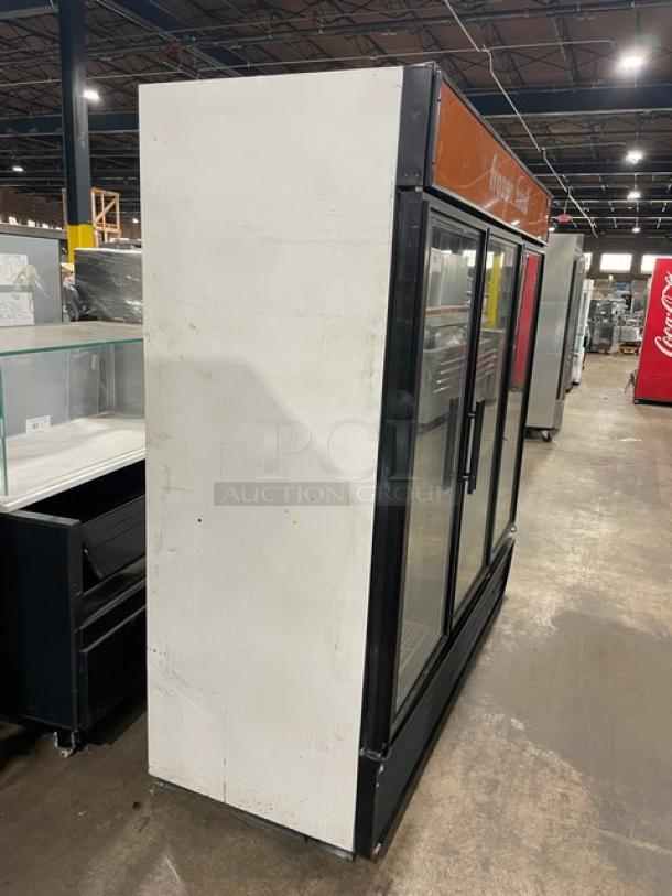 True Commercial Black Triple Glass Door Freezer, Model GDM-72F, with poly-coated wire racks. Used condition.