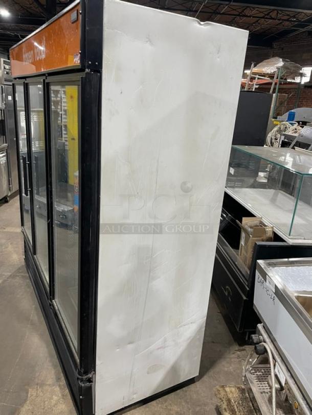 True GDM-72F commercial freezer, triple glass swing doors, poly-coated wire racks, model GDM-72F, 115/208-230V, used condition.