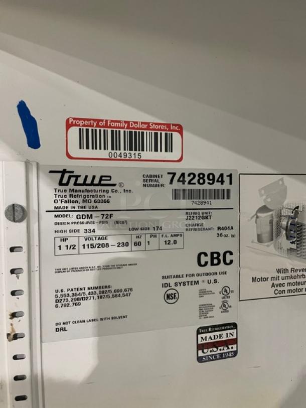 True triple glass door reach-in freezer, model GDM-72F, with poly-coated wire racks. Serial: 7428941, 115/208-230V, 1 phase.