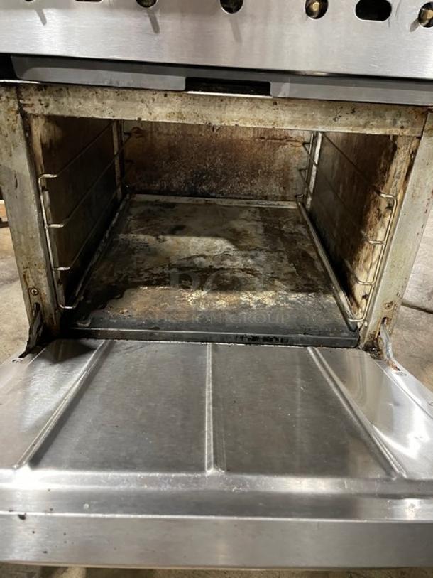 CPG 4 Burner Range/Oven, Model 351S24N, stainless steel, natural gas, with backsplash and salamander shelf, on casters.