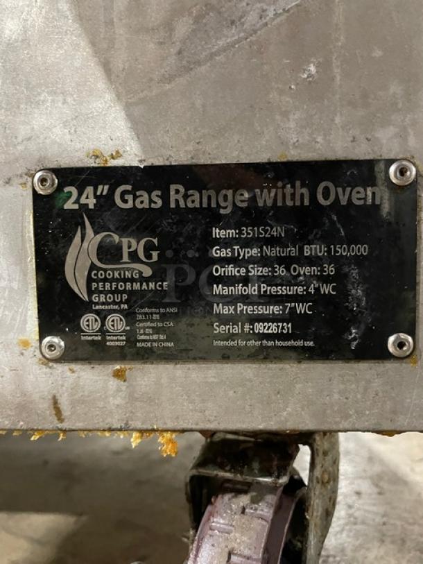 CPG stainless steel 4-burner gas range/oven, model 351S24N. Includes backsplash, salamander shelf, casters. SN: 09226731.