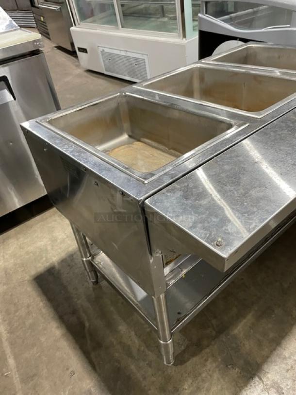Eagle Group stainless steel gas-powered 3-pan hot food/steam table with tray slide and single undershelf on legs.