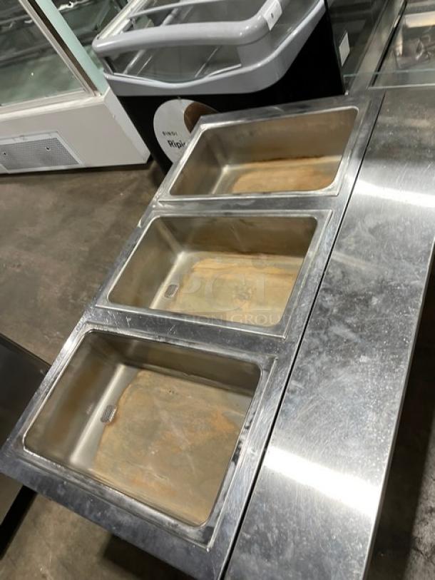 Eagle Group stainless steel 3-pan gas steam table, with tray slide and single undershelf, on legs.