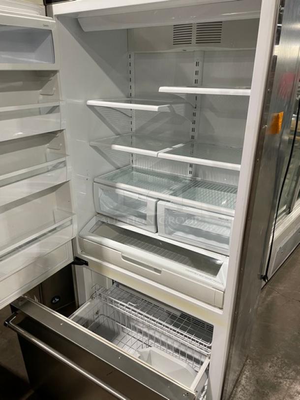 Viking Professional Series stainless steel refrigerator freezer combo with adjustable shelves and poly coated wire basket.