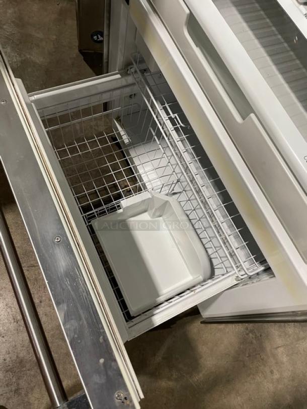 Viking Professional Series stainless steel refrigerator freezer combo with single door, drawer, adjustable shelves, wire basket.