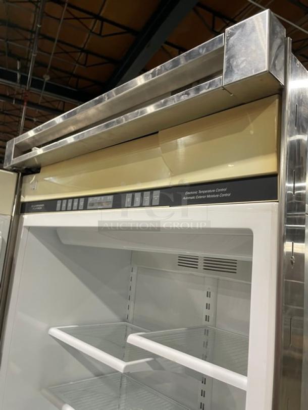 Viking Professional stainless steel fridge-freezer combo with adjustable shelves, wire basket, and electronic controls.