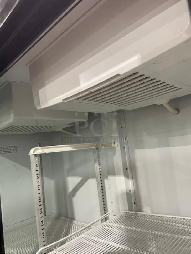 Imbera VRD43 commercial refrigerator interior, white-coated wire racks, Energy Star certified, model 2020.