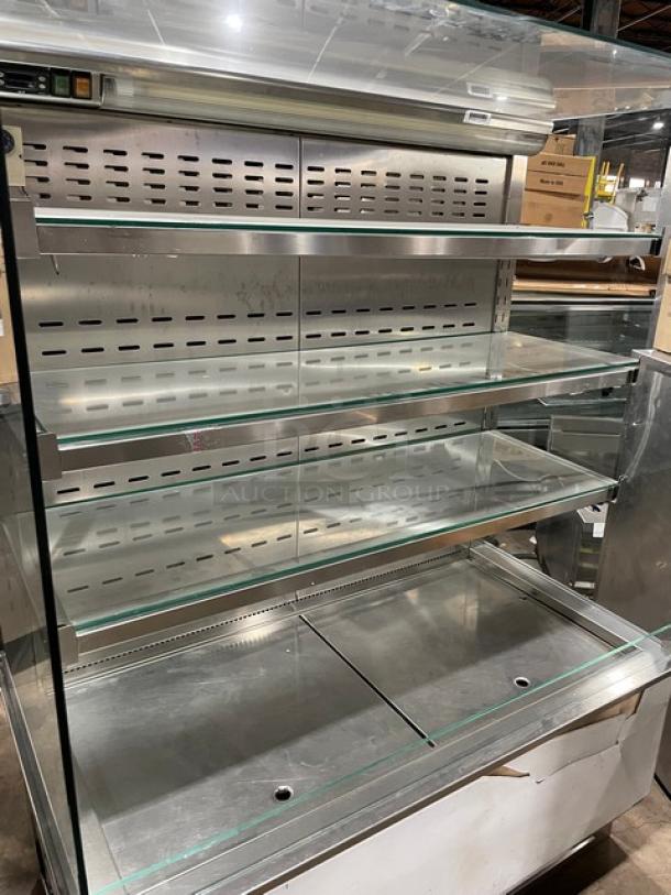 Commercial stainless steel refrigerated open merchandiser display case with straight glass and adjustable shelves.