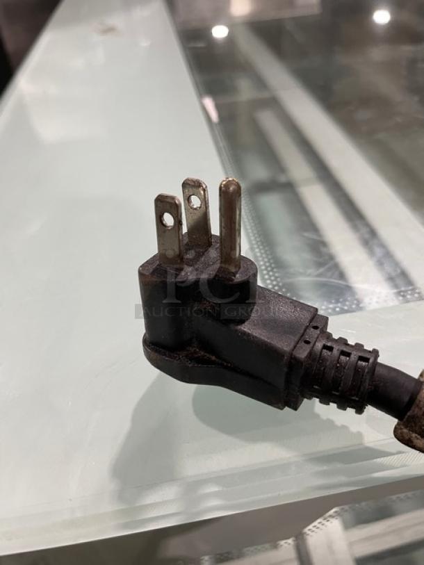 The image shows a three-prong power plug for the Imbera VR12C02 commercial refrigerator.