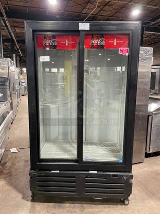 Imbera VRD37C02 Coca-Cola style commercial merchandiser with double glass sliding doors, black finish, Energy Star certified, on casters.