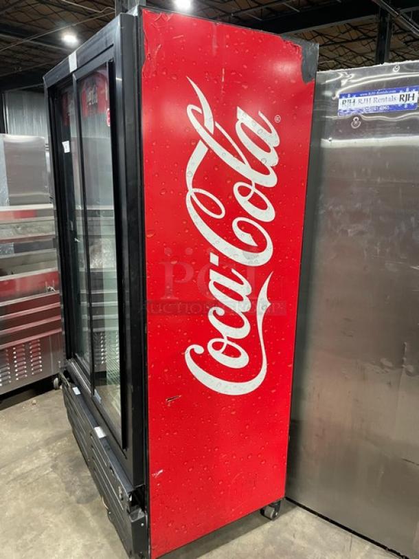 Imbera 2015 Coca-Cola style black double glass sliding door merchandiser refrigerator, Model VRD37C02, on casters.