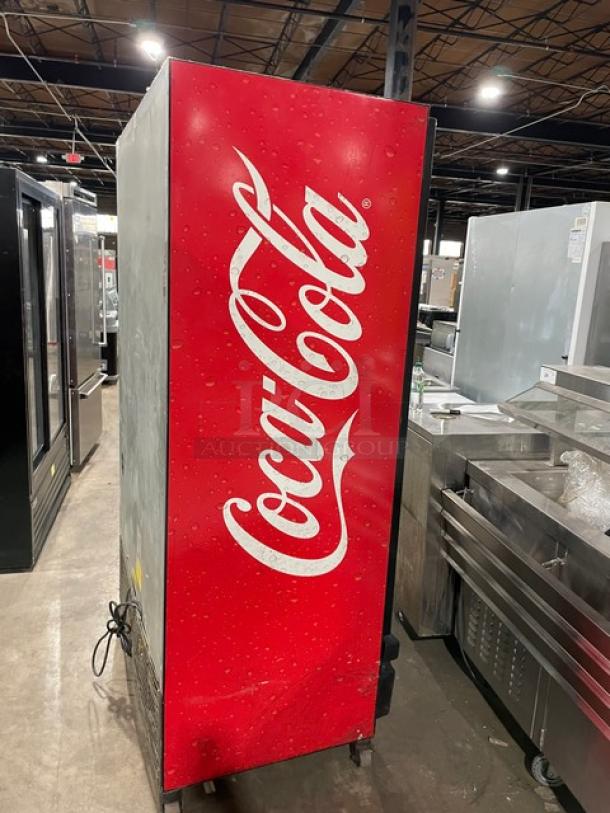 Imbera VRD37C02 Coca-Cola style commercial refrigerator, late model, black double glass sliding doors, Energy Star certified, on casters.