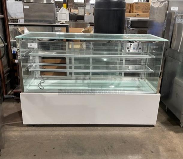 Commercial white refrigerated bakery display case with straight glass, multi-tier shelving, and rear double sliding glass doors.