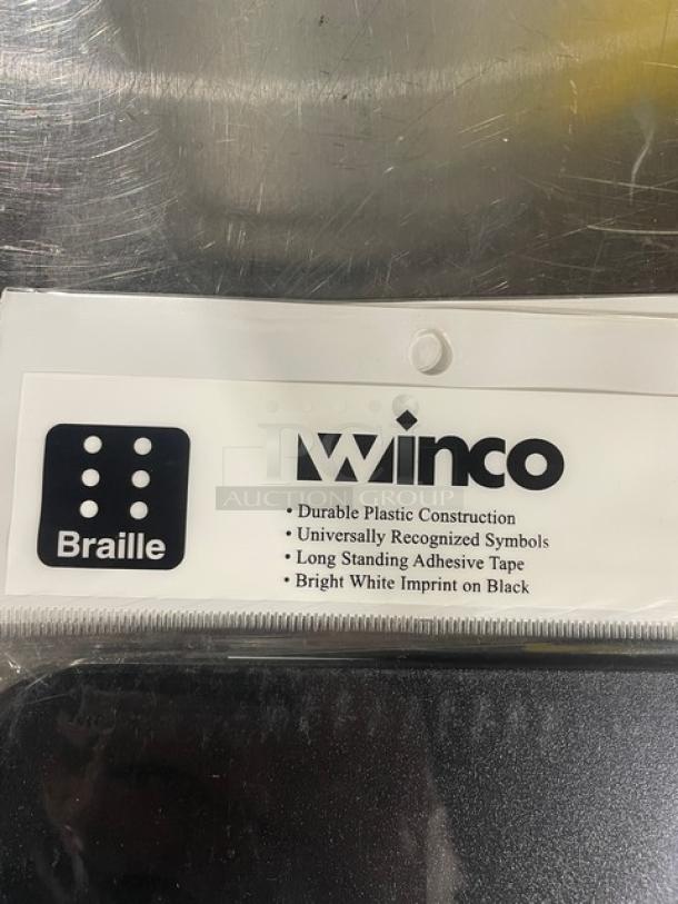 Winco SGNB-608 All Gender Restroom Sign, durable black plastic, Braille, universal symbols, adhesive tape, new condition.