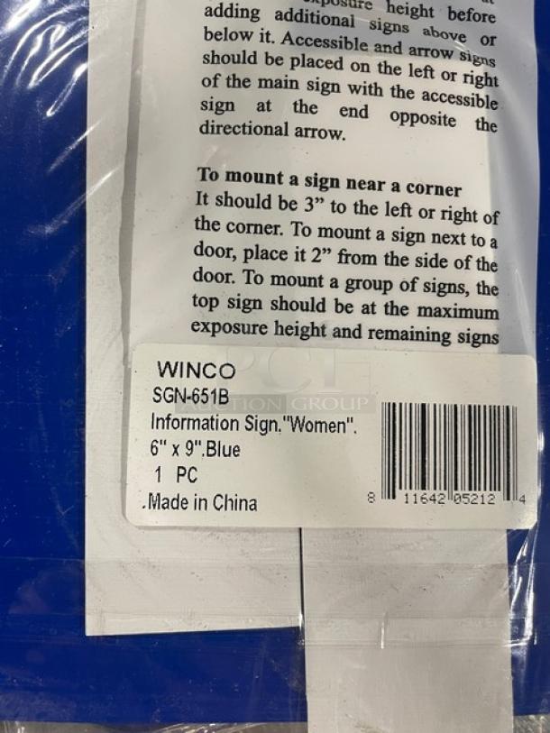Winco SGN-651B Women/Accessible sign, blue, 6"x9", new condition, with mounting instructions and label indicating model and origin.