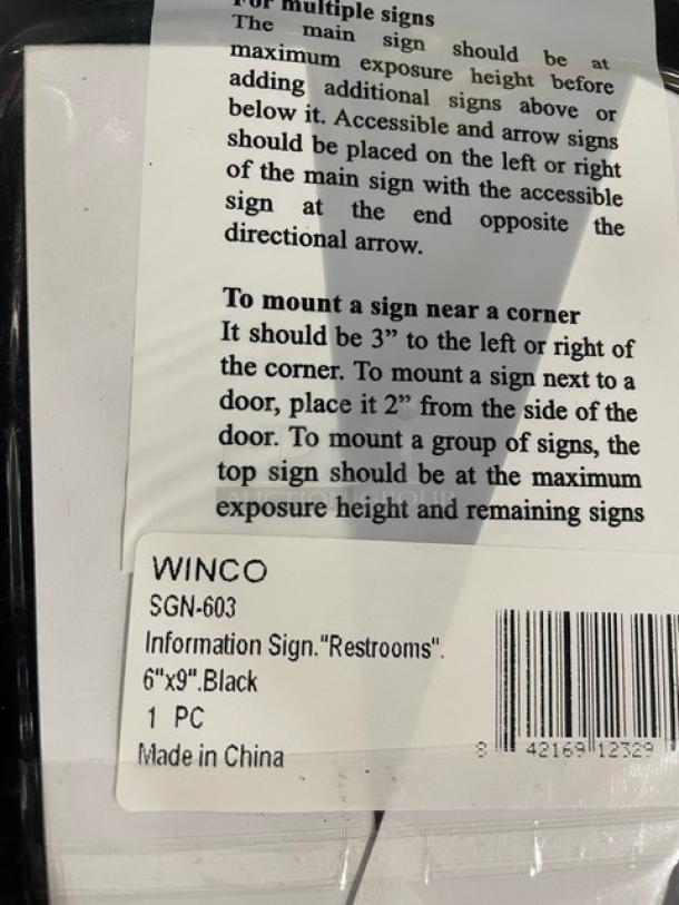 Winco SGN-603 "Restrooms" sign, black, 6"x9". New condition, includes mounting instructions and product label.