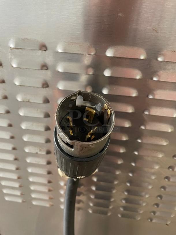 Vulcan commercial double-stacked convection oven power plug, showing electrical connector against stainless steel background.