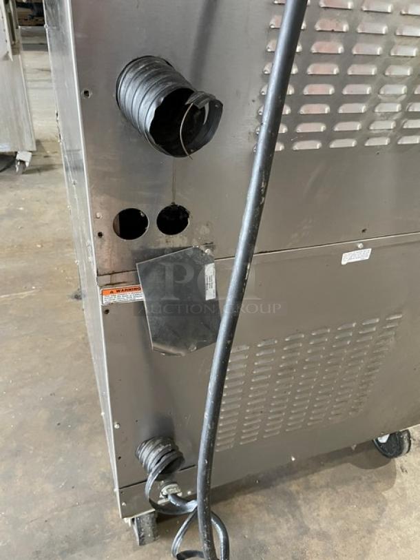 Vulcan Commercial Stainless Steel Electric Double Stacked Convection Oven on Casters, wired for use, showing rear panel details.