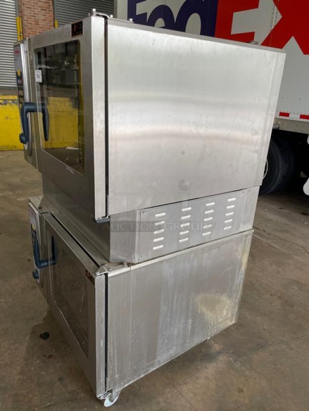 Rational SCC62G commercial stainless steel double stacked combi oven on casters with wired racks, blue gas hose.