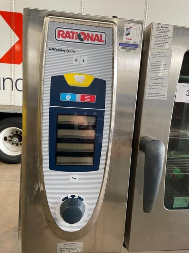 Rational SCC62G commercial combi oven, stainless steel, natural gas, double stacked, wired racks, blue gas hose, on casters.