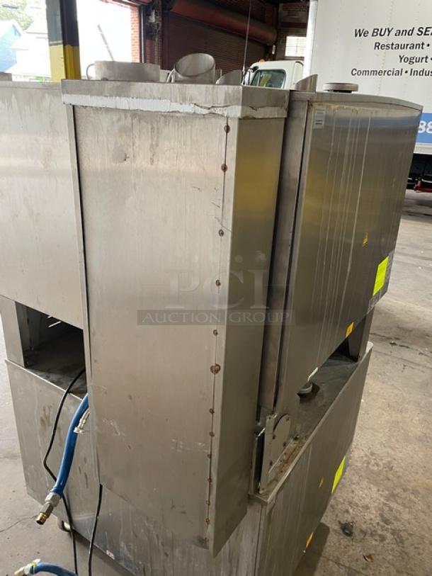 Rational SCC62G double-stacked combi oven, stainless steel, natural gas, with wired racks and blue gas hose. On casters.