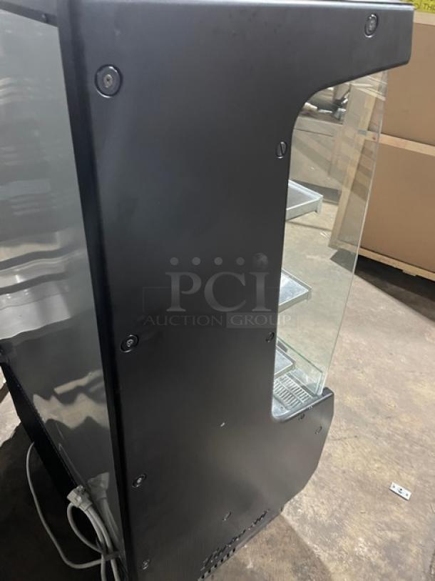 Turbo Air TOM-40MB black refrigerated open merchandiser, stainless steel interior, multi-tier shelves, 120V, excellent condition.