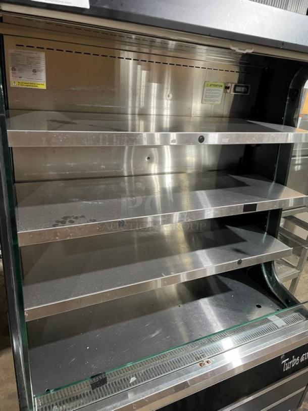Turbo Air TOM-40MB multi-tier refrigerated open merchandiser with stainless steel interior and shelves. Black exterior.