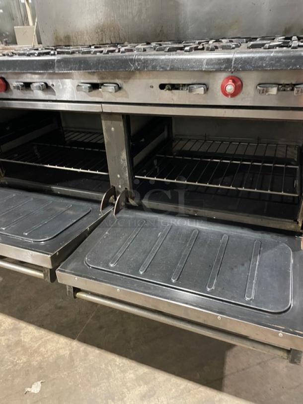 Vulcan commercial 10-burner range with double oven, stainless steel, natural gas, backsplash, overhead salamander shelf.