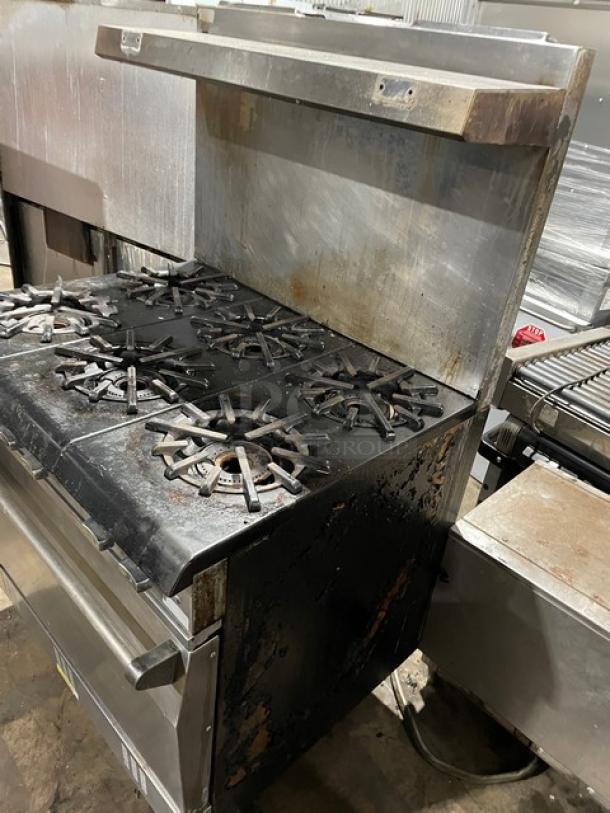 Vulcan commercial stainless steel 6-burner range/oven combo with backsplash, overhead salamander shelf, and wired oven rack.