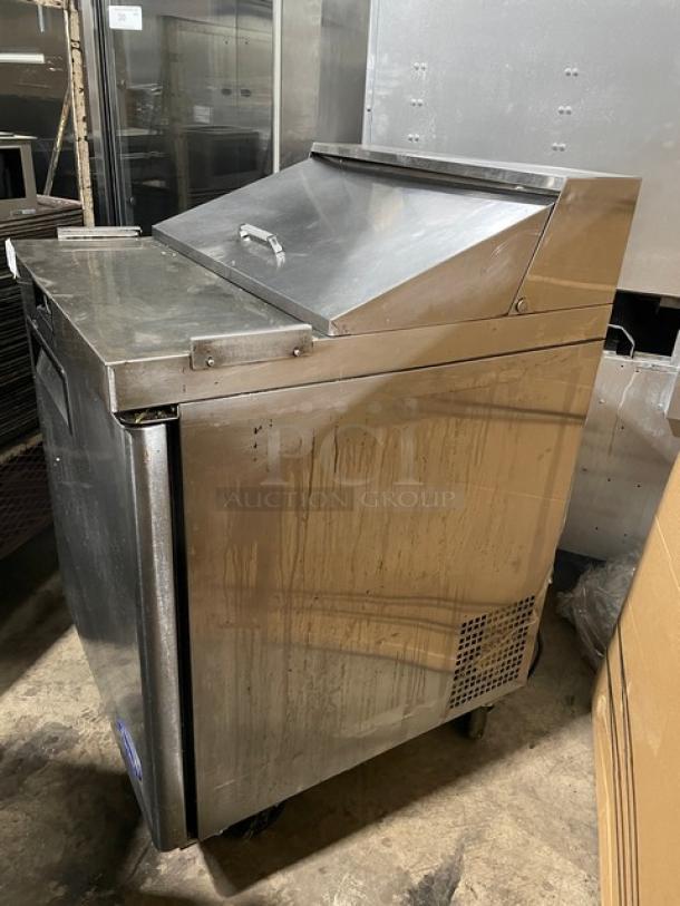 Atosa 2019 commercial stainless steel refrigerated prep table, model MSF8301GR, single door, with wire rack, on casters.