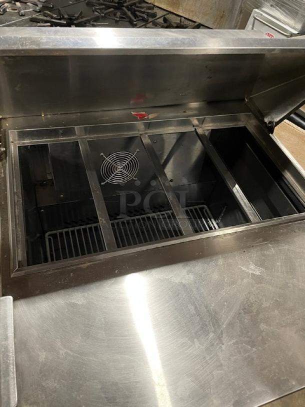 2019 Atosa MSF8301GR stainless steel refrigerated prep table, single door, poly-coated wire rack, on casters.