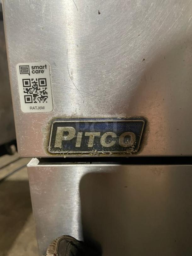 Pitco VF35S stainless steel deep fat fryer, 35 lb. capacity, on legs, with backsplash, basket hanger, and blue gas connector.