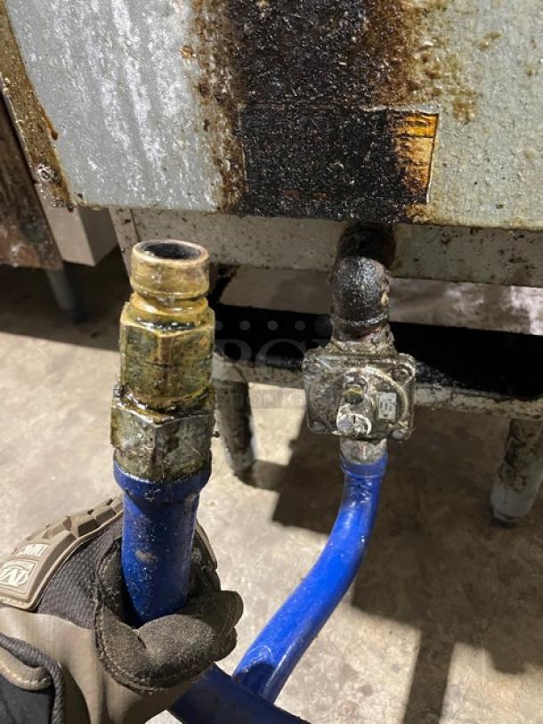 Pitco VF35S stainless steel natural gas fryer connection point with blue gas hose, showing wear, Model: VF35S, SN: G12BC005211.