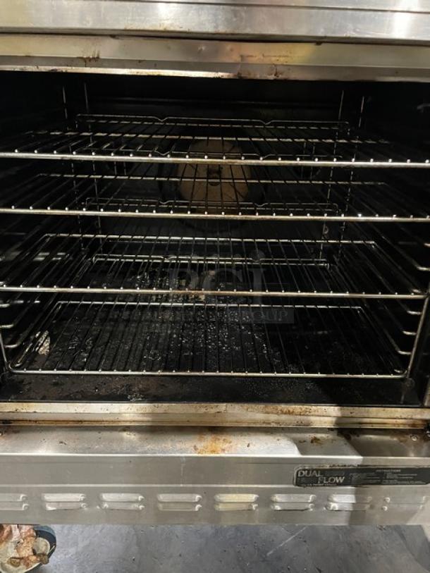 Blodgett Solid State Series stainless steel double-stacked convection oven, natural gas-powered, with wired racks on casters.