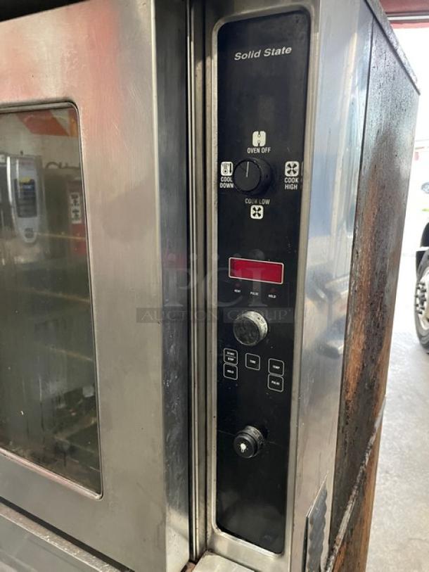 Blodgett Solid State Series commercial stainless steel natural gas double convection oven, wired racks, on casters, in used condition.
